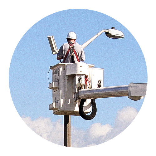 cherry picker working at a lightpost