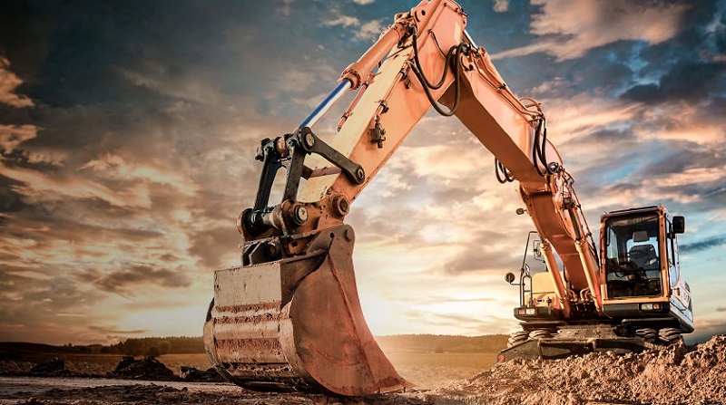 excavator profile image with sun at horizon