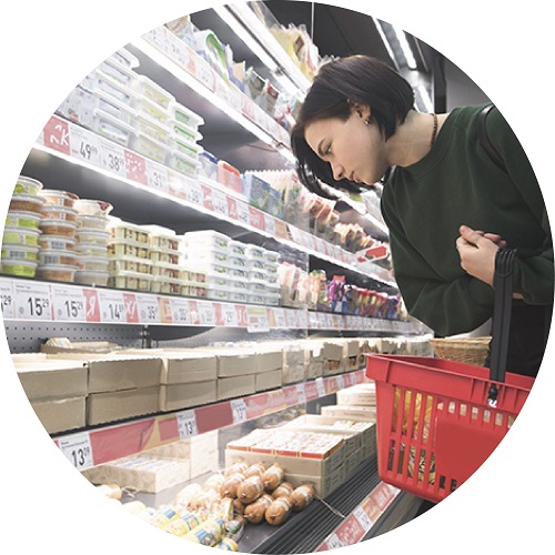 Woman viewing items at grocery store