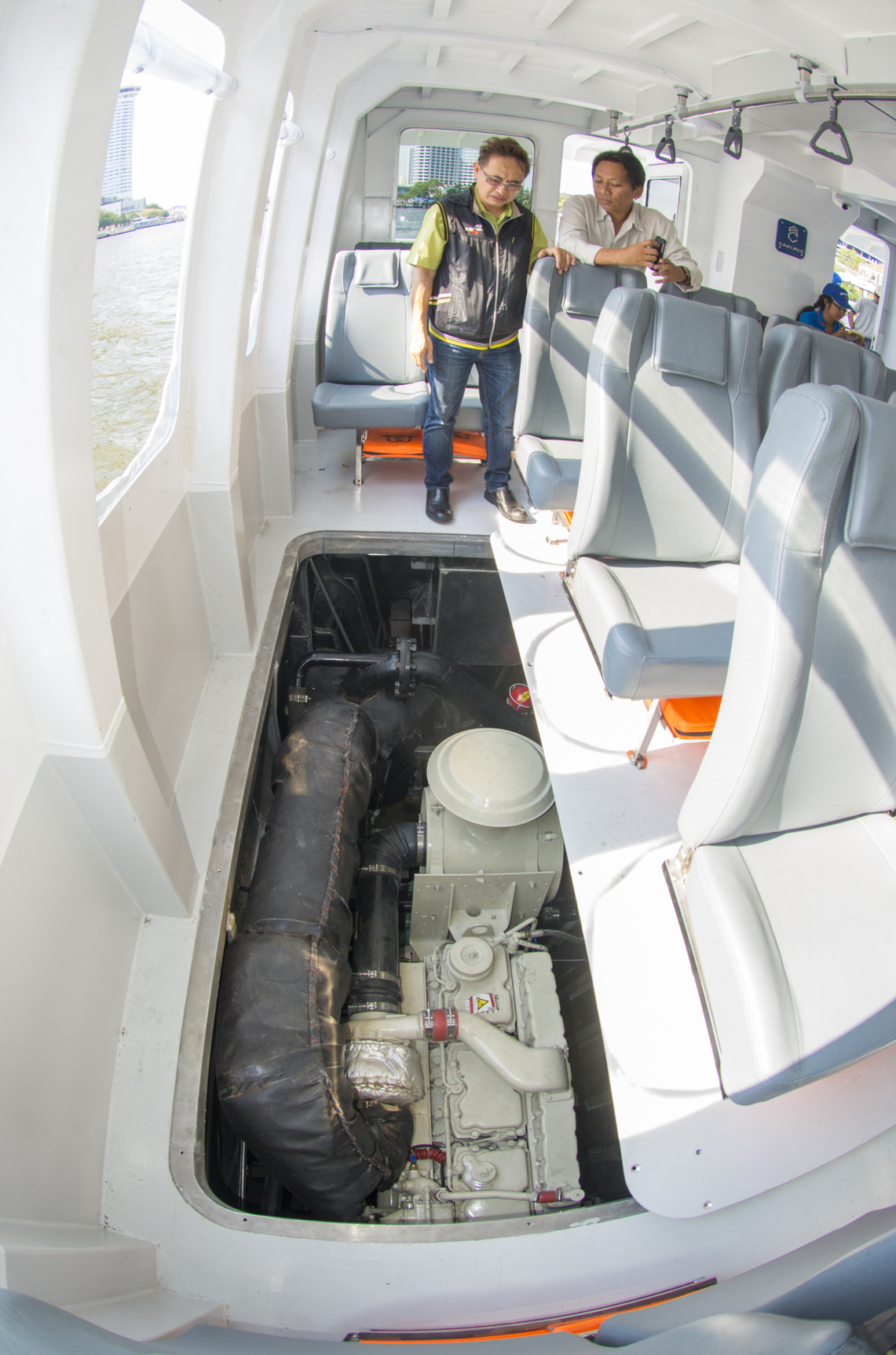 Cummins marine sales manager Sathit Suwanprasert checks one of the NT855s with an owner’s representative. Engines are accesses by moving a set of seats.