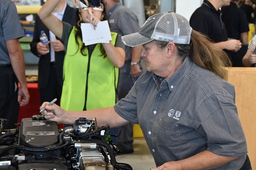 Debra Wilson leaves her mark on Cummins 3 millionth engine for RAM.