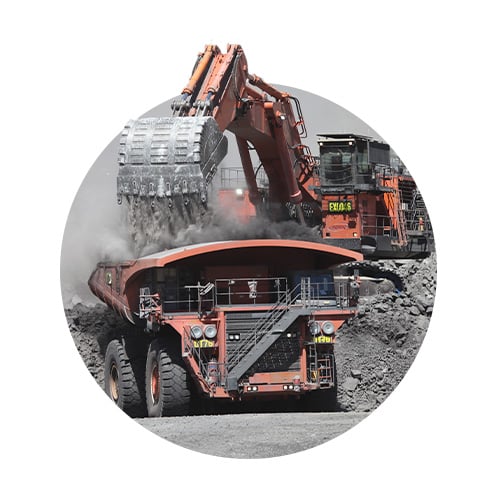 Mining digger dumping rocks 