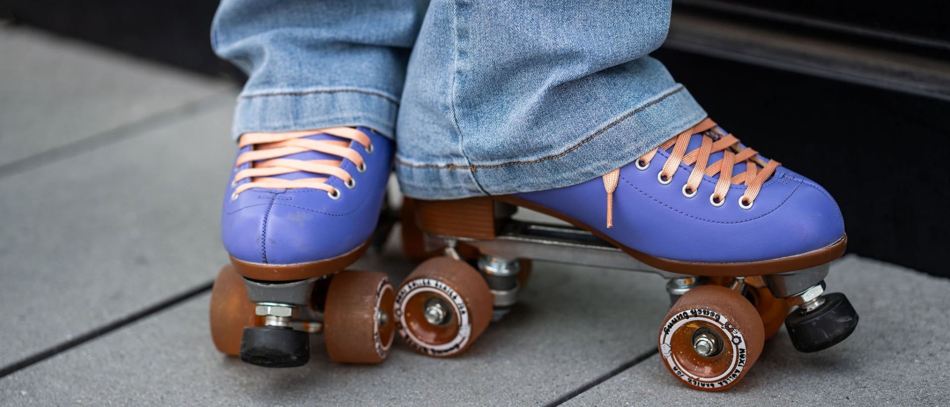 Close-up of Meko’s purple roller skates outdoors in Atlanta.