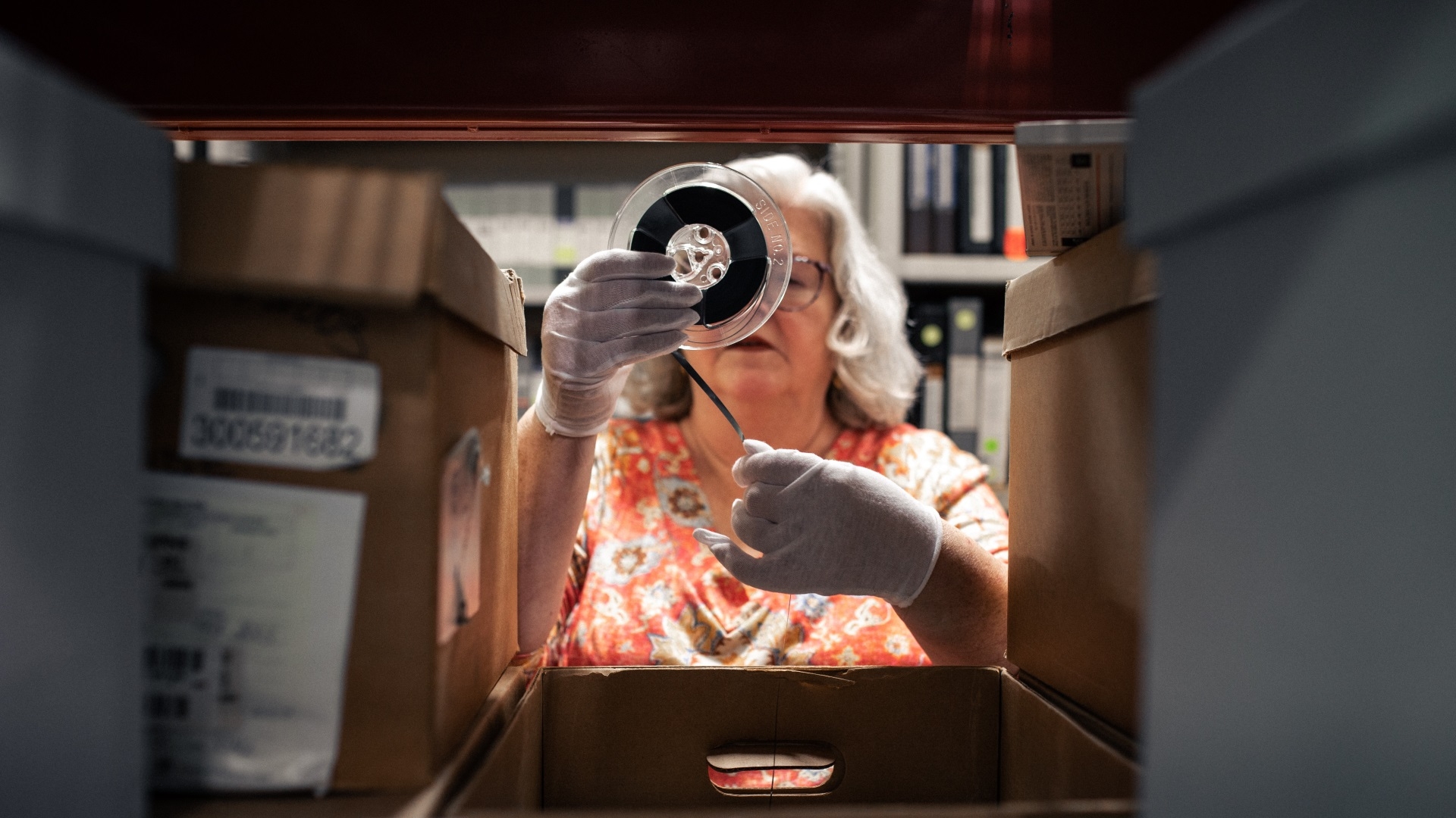 woman looking through archives