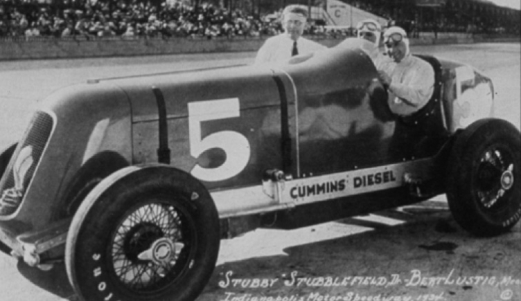 Clessie Cummins poses with driver "Stubby" Stubblefield and mechanic Bert Lustig Clessie Cummins poses with driver "Stubby" Stubblefield and mechanic Bert Lustig