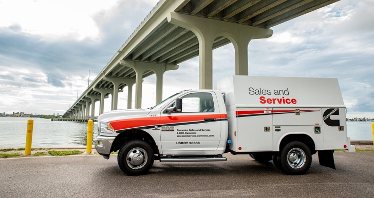 Sales and Service truck parked by bridge