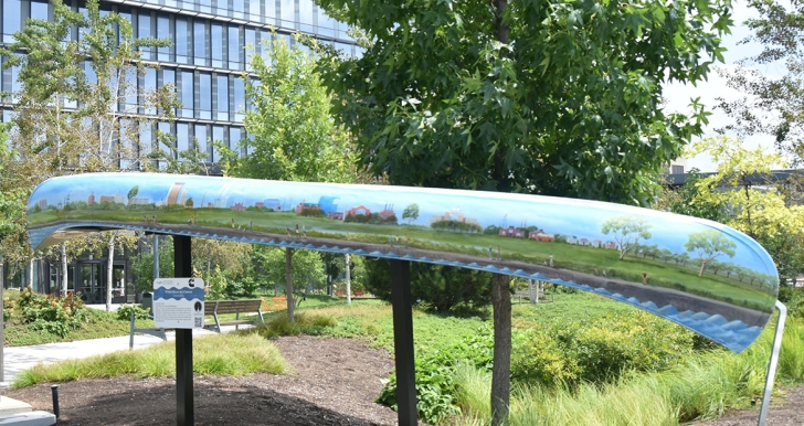 painted art canoe installation outside of Cummins office