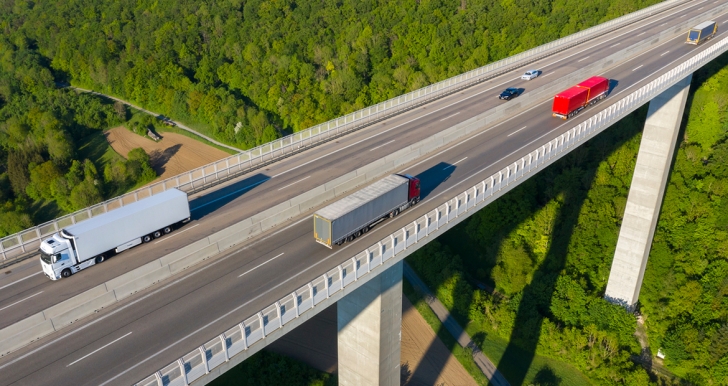 semis driving on a bridge