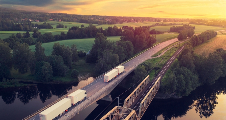 semi trucks on highway bridge