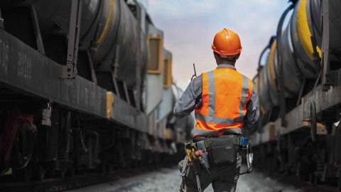 rail technician inspecting train