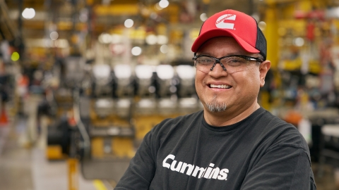 Cummins facility technician with industrial equipment