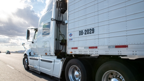 side angle of heavy duty truck driving on highway
