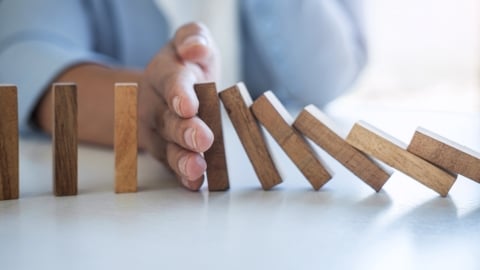 hang stopping domino blocks from falling