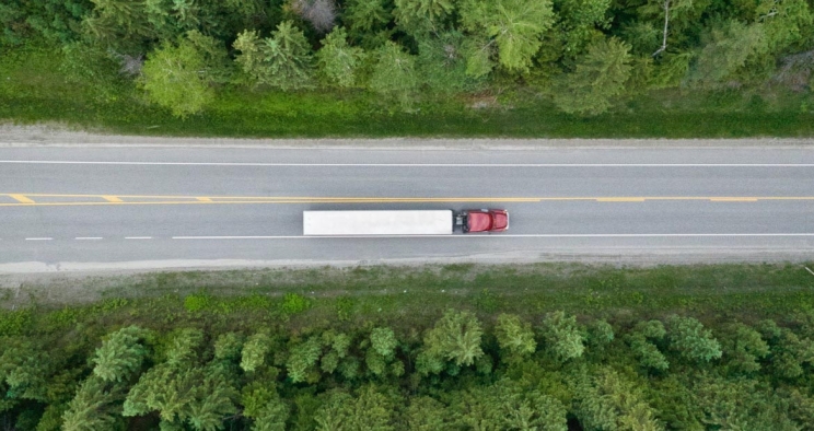 Aerial view of semi driving on road