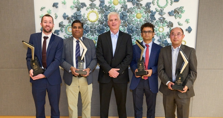 recipients holding trophies