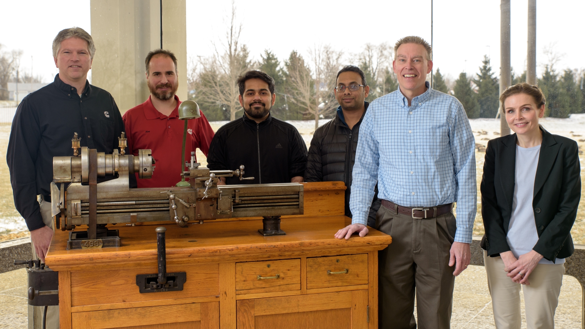 Michael Blanz (second from right) and his team gather around the lathe Clessie Cummins used to invent the Jake brake. Michael Blanz (second from right) and his team gather around the lathe Clessie Cummins used to invent the Jake brake.