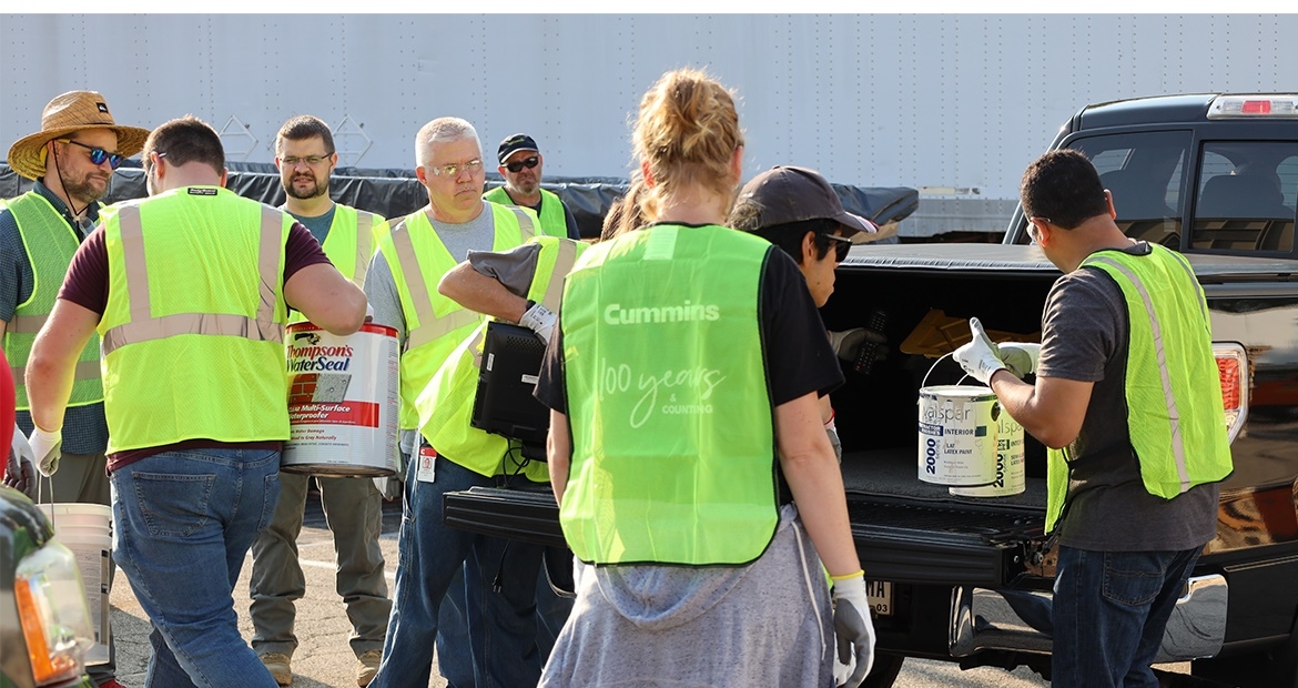 Cummins employees at the Columbus Engine Plant unload waste paint at a community recycling day at the plant earlier this year.
