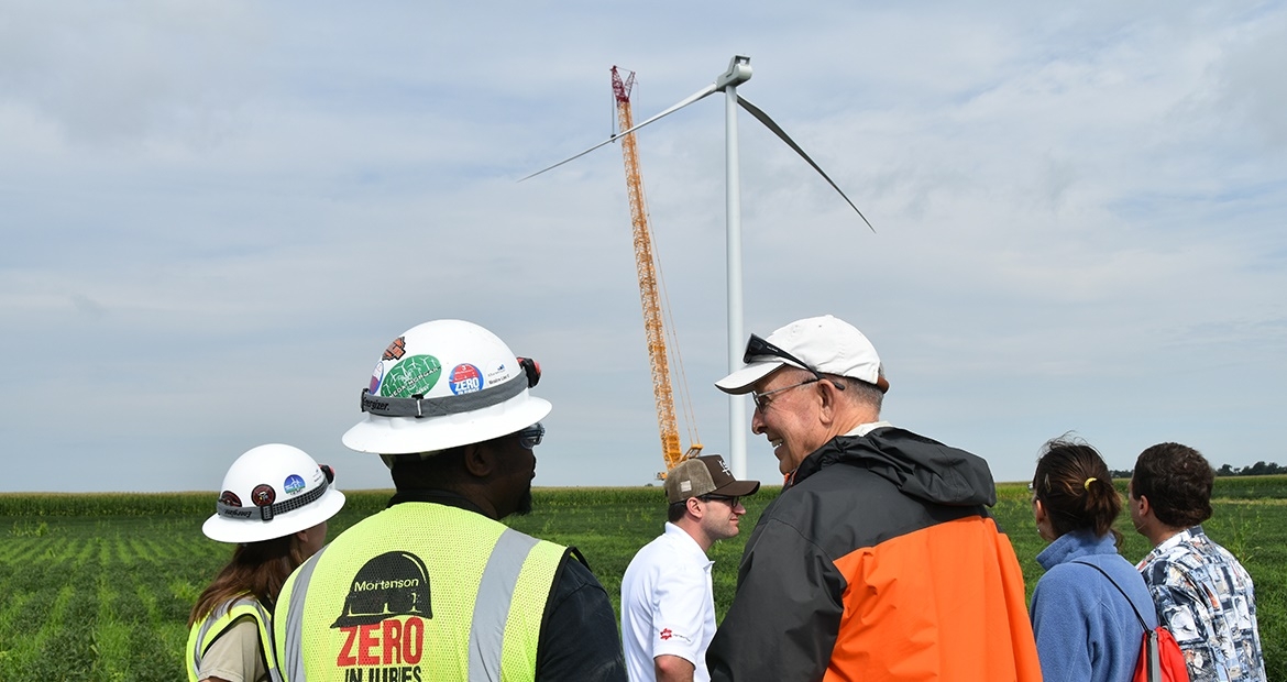 Visitors to the Meadow Lake Wind Farm in northwest Indiana look at one of the first wind turbines to go up at an expansion Cummins is supporting through a Virtual Power Purchase Agreement. When complete in early 2019, the expansion will include more than 50 wind turbines and a capital investment of about $340 million.