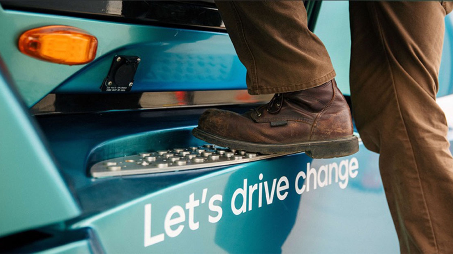 Person's boot stepping onto truck