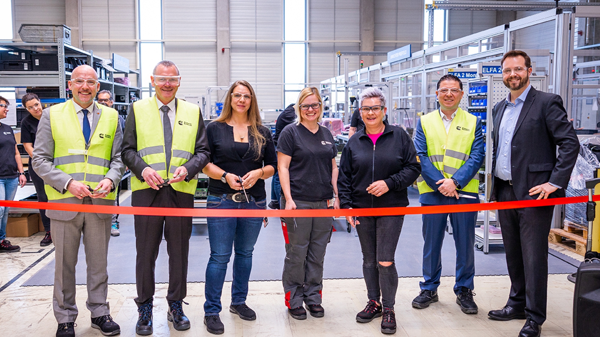 Employees at ribbon cutting