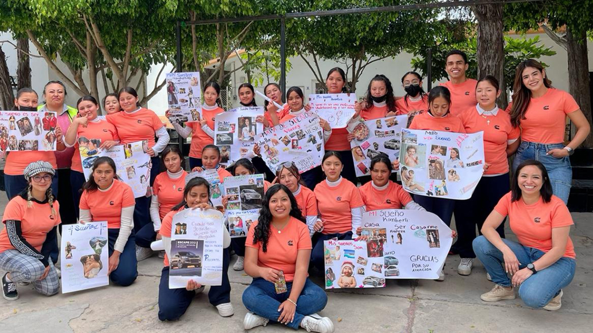 employees with students celebrating IWD