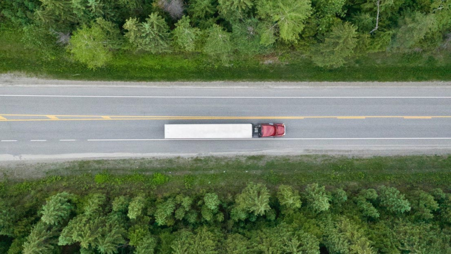 Aerial view of semi driving on road