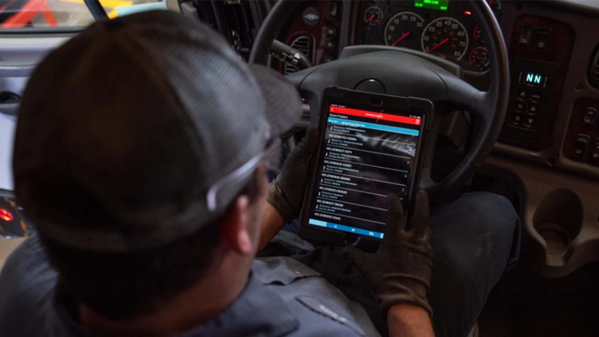 Driver looking at diagnostics app