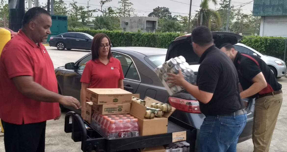 Cummins employees in Puerto Rico unload supplies to keep the branch going over long hours. Cummins employees in Puerto Rico unload supplies to keep the branch going over long hours.