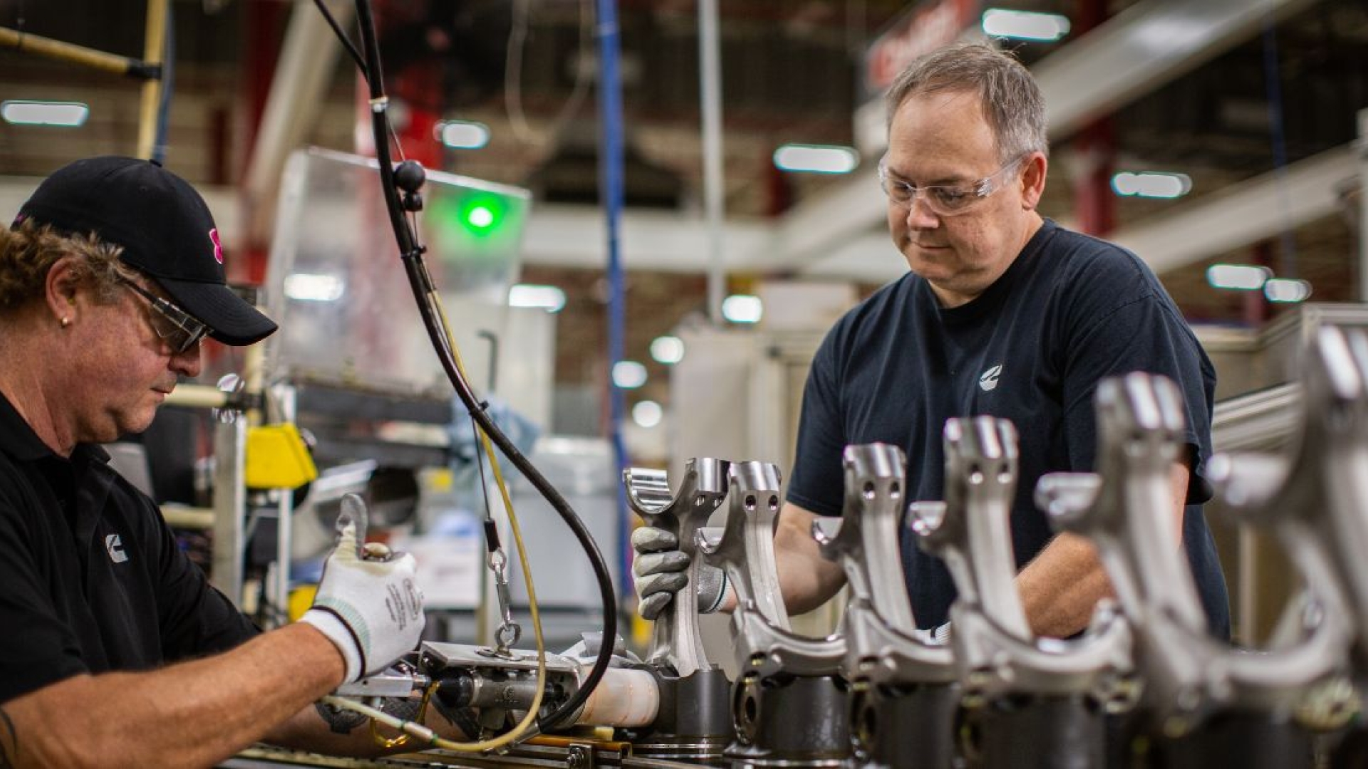 Employees working on engine