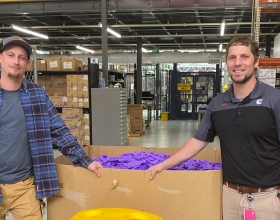 employees in front of gloves