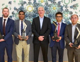 recipients holding trophies