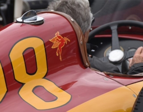 Mario Andretti driving the historic Cummins race car