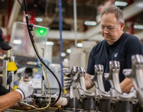 Employees working on engine