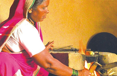 indian woman stoking fire