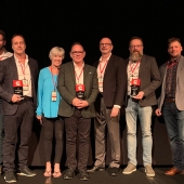 Canada winners holding awards