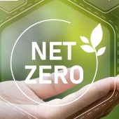 'net zero' in a bubble floating above a hand