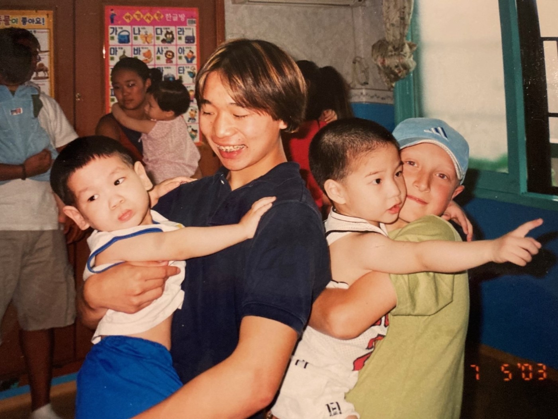 kids holding toddlers