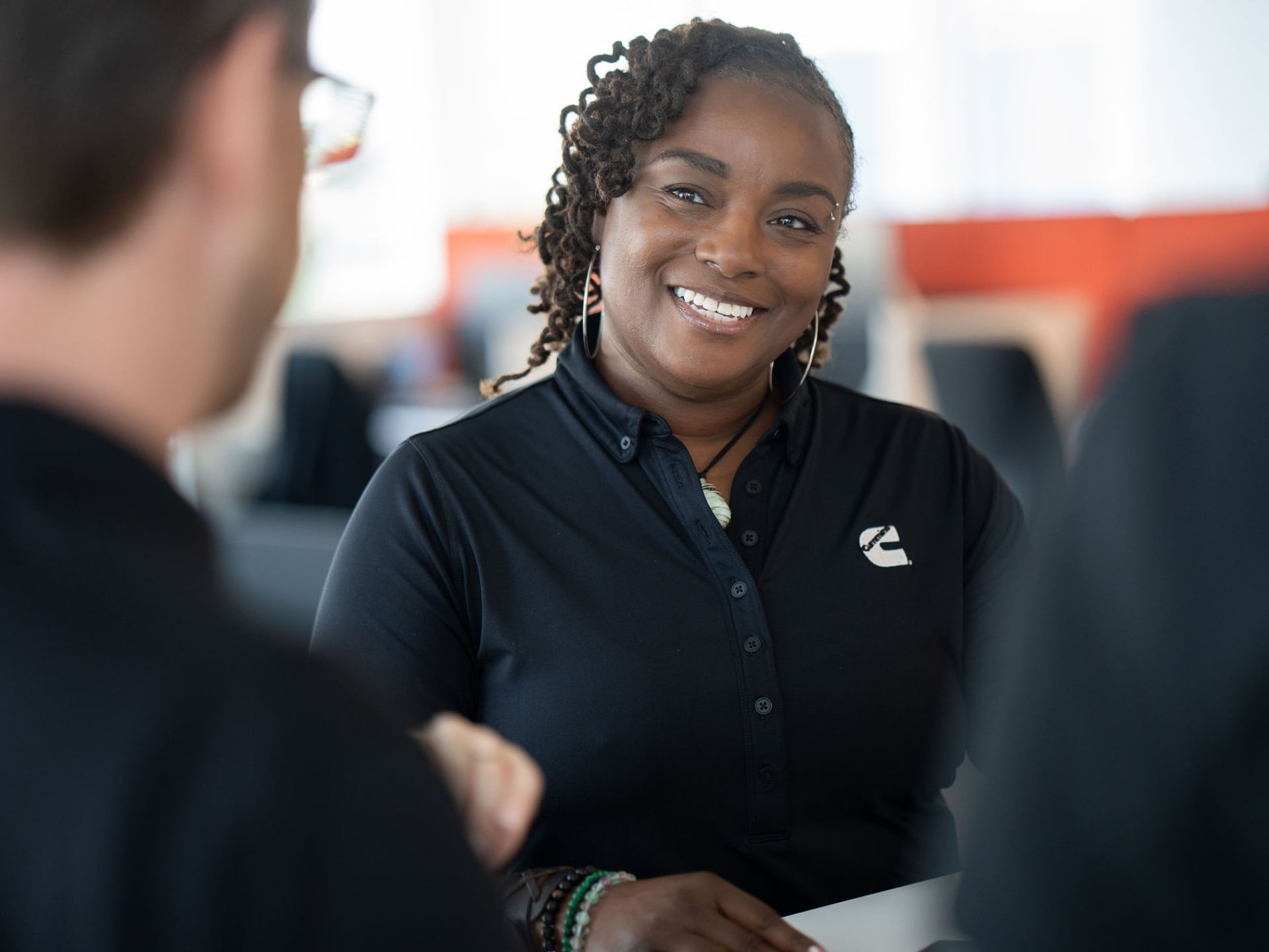 Meko Taylor smiles during a team meeting in Atlanta as part of her Cummins community leadership work.