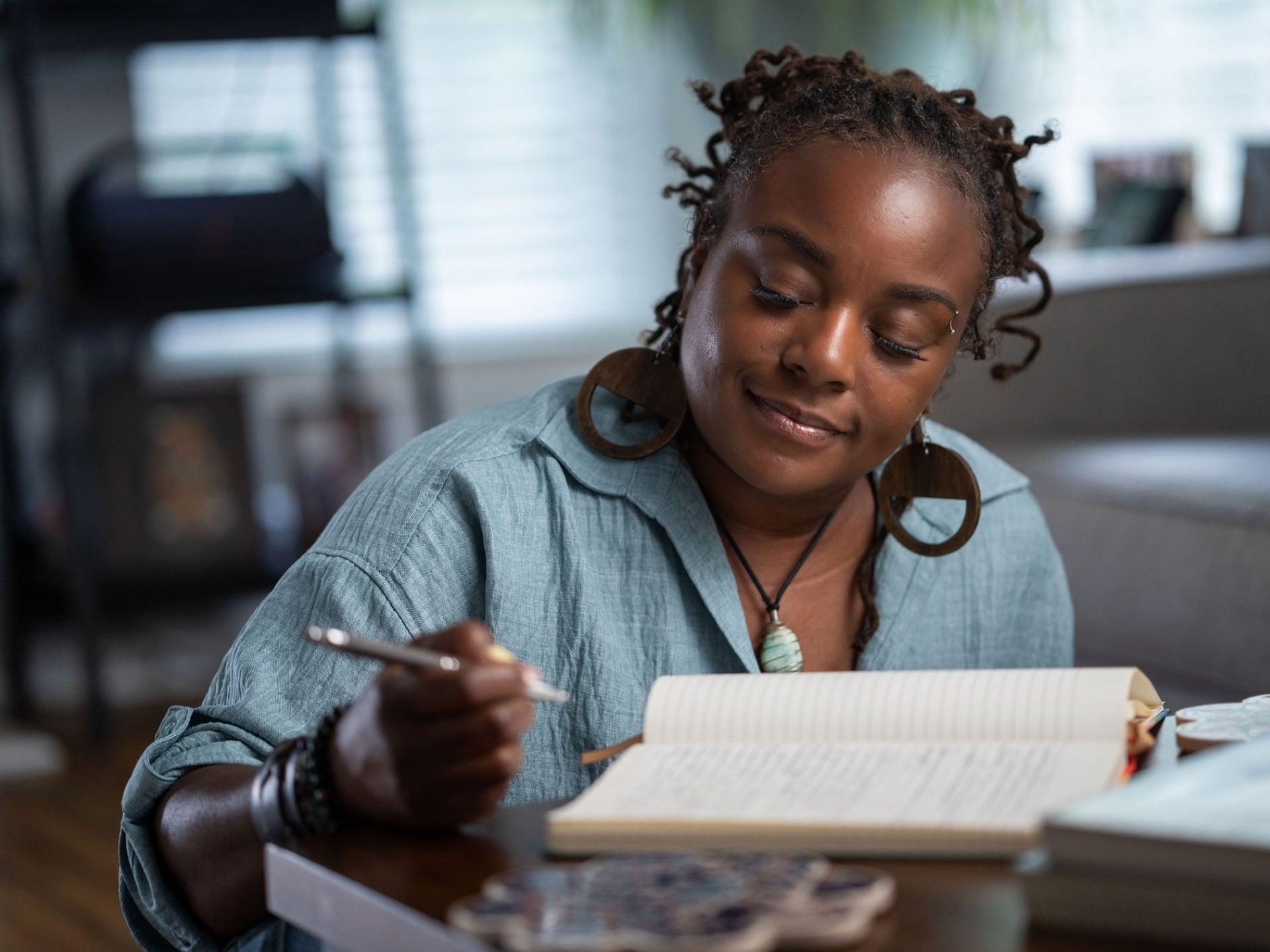 Meko journals at home as part of her daily reflection practice