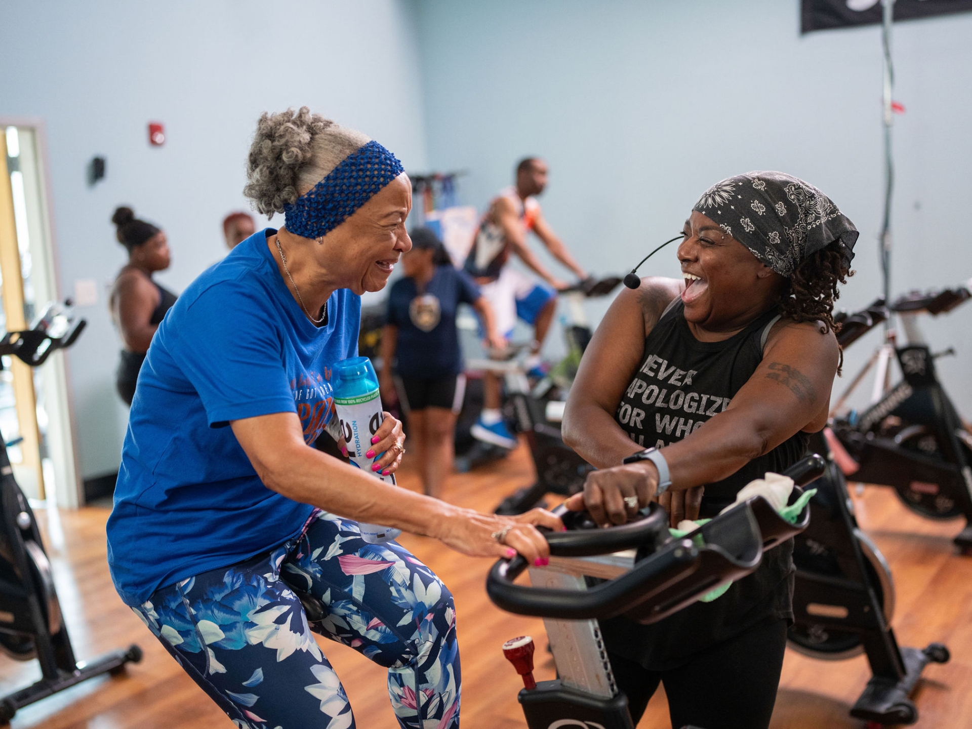 Meko laughs with a participant during a spin class in Atlanta.