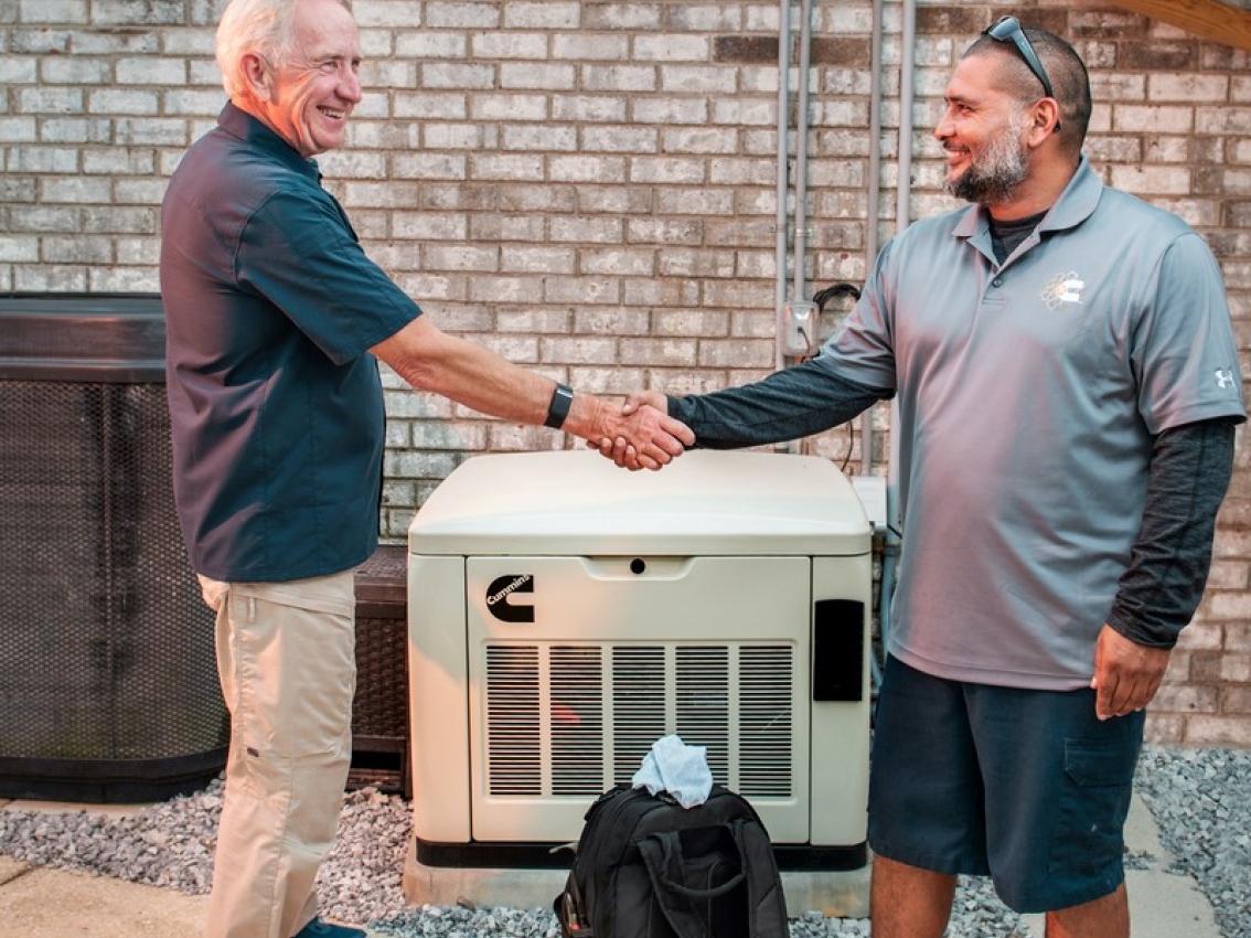 generator technician helping customer