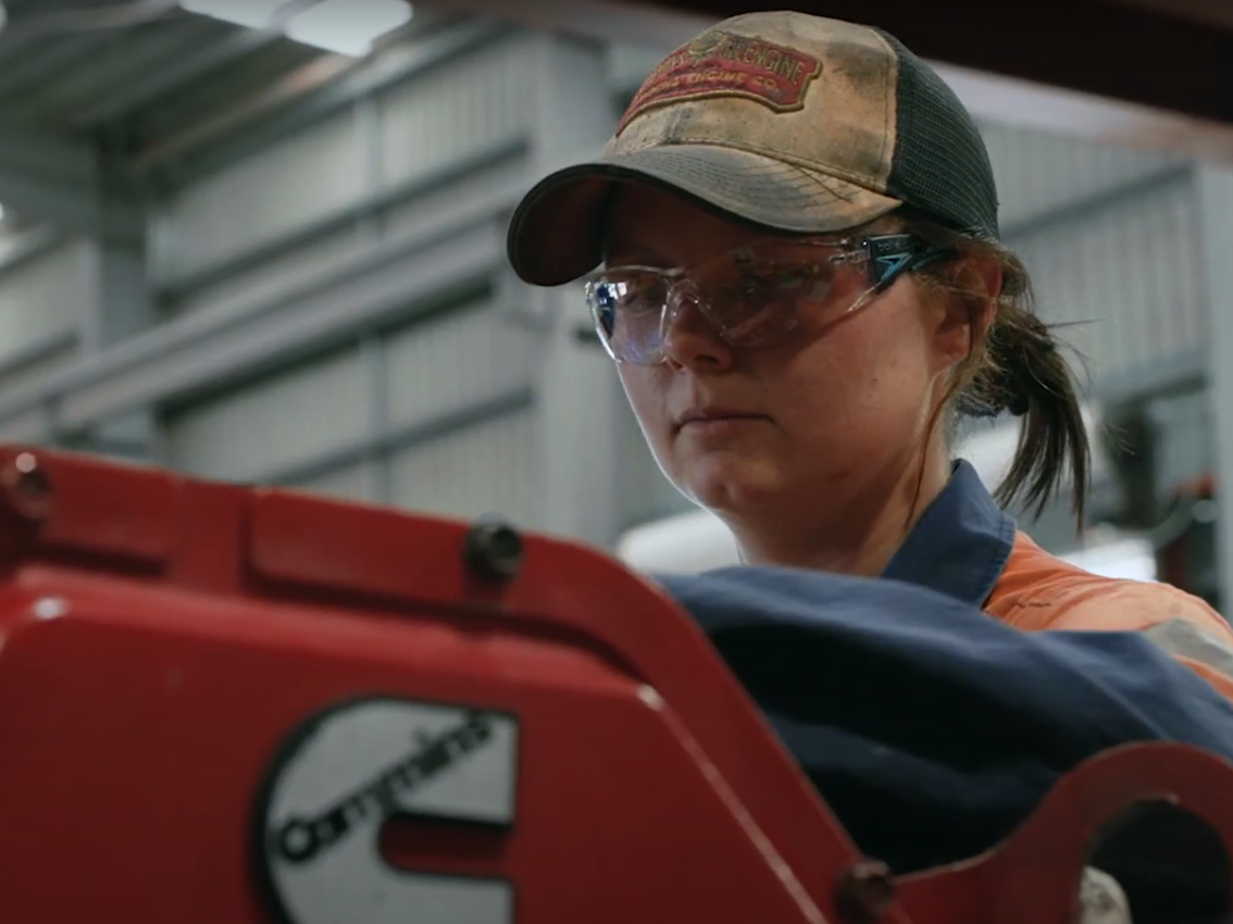 person working on machine at engine factory