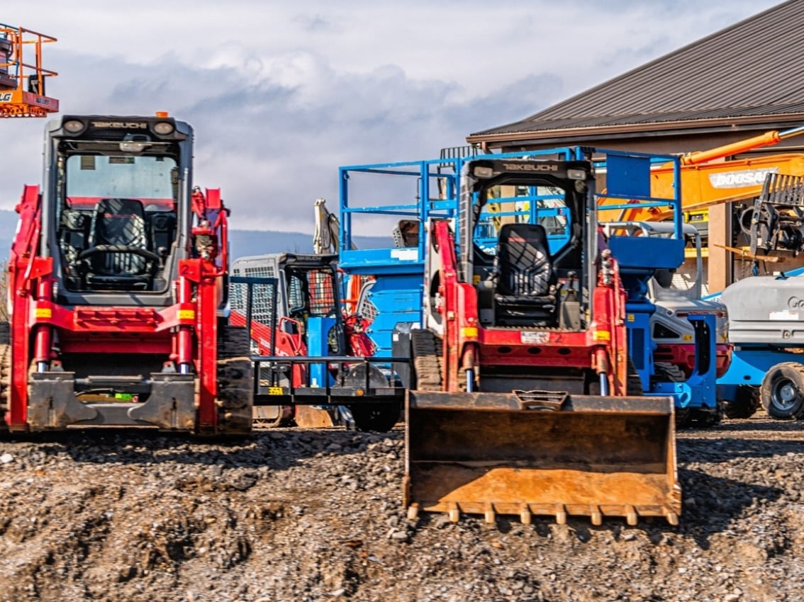 Rental construction equipment on dirt